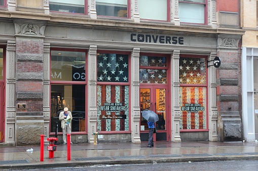 People visit Converse store in Broadway, New York. Broadway is a famous 33 miles long street starting in Manhattan.
