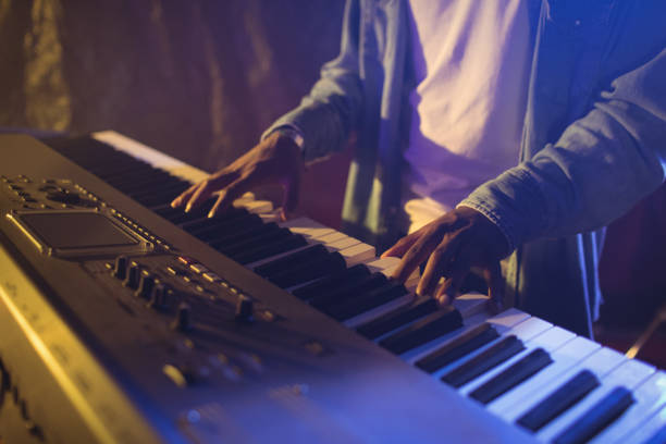 istock Mid section on male musician playing piano 803050244