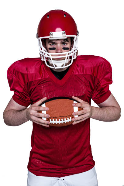 istock American football player holding a ball 803057914