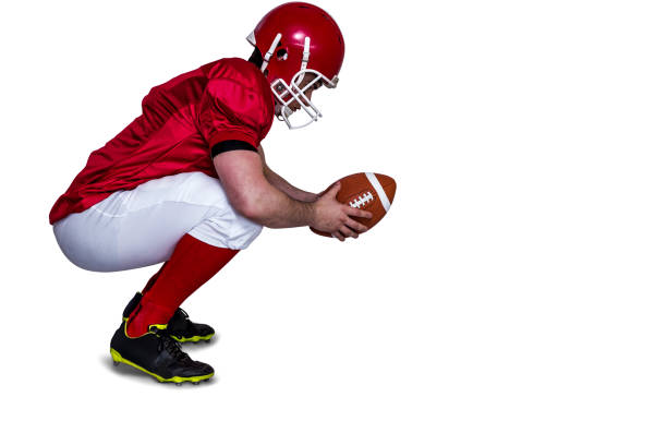 istock American football player in attack stance 803062674