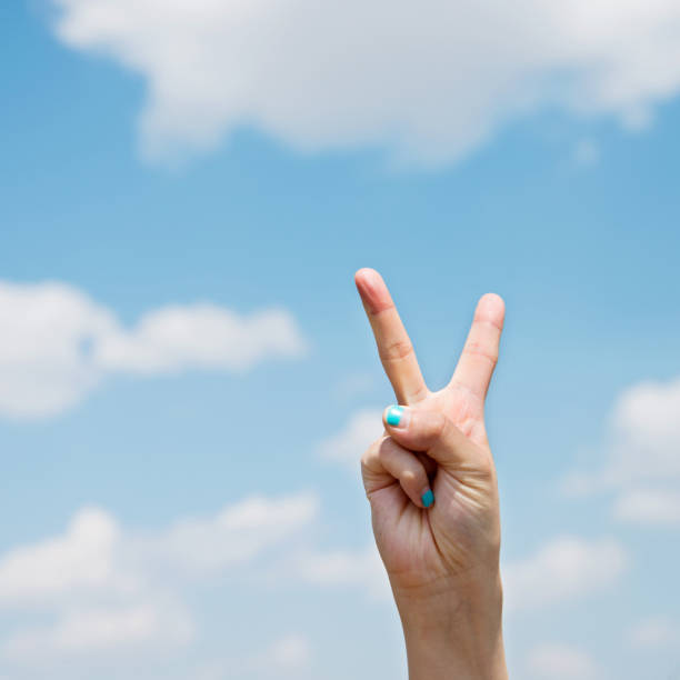 istock Woman hand stuck out two fingers 803062702