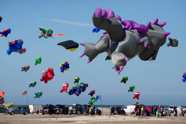 FANOE, DENMARK JUNE 17, 2017: Colorful dragon kites in the air over Fanø beach. Fanoe Kite Fliers Meeting June 2017.