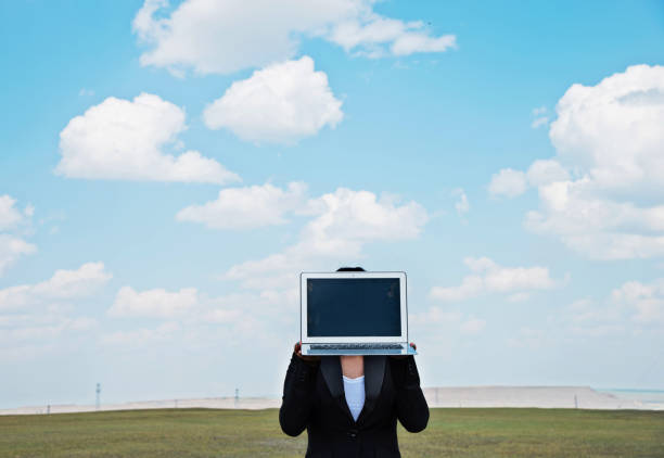 Woman holding a laptop