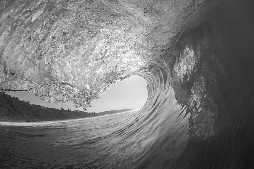 Wave inside swimming ocean black and white photo