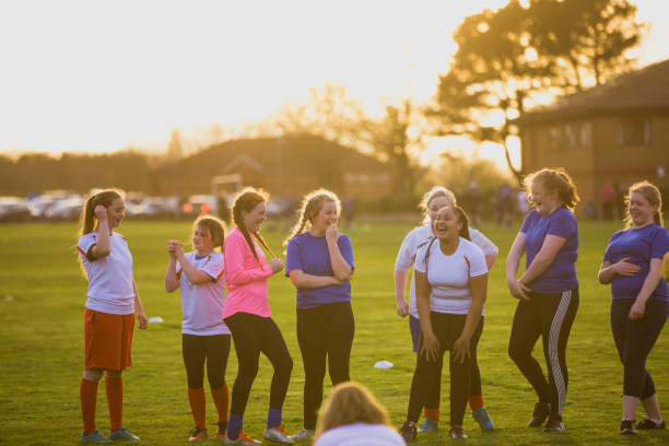 istock Rugby Girls Laughing Together 803101618