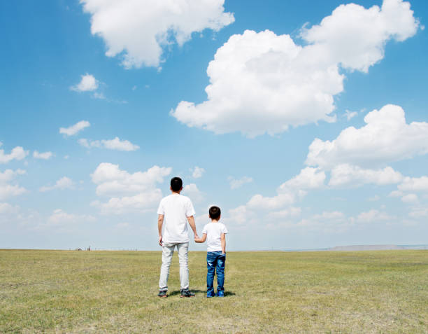 istock Father and son hand in hand 803102238