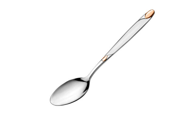 istock Stainless steel spoon with rose gold design on white background isolated 803102280