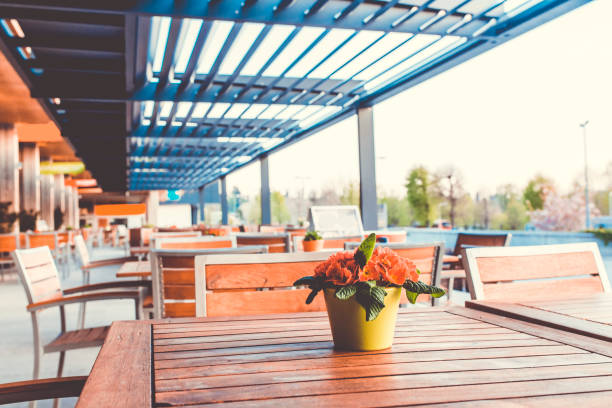 Outdoor restaurant terrace with tables and chairs, roof, outdoors, eating and drinking, travel destinations