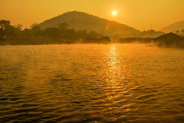 istock Huts floating on lake with sunrise 803118850