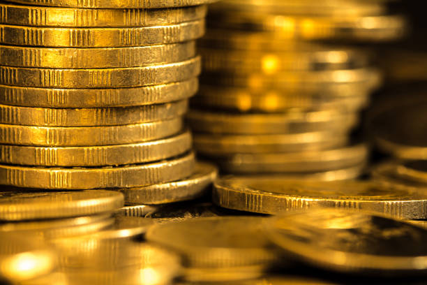 istock Close up gold money coin stacking on dark background 803119030