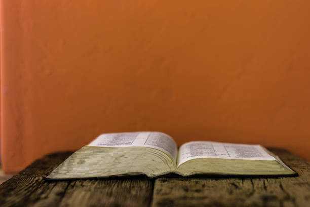 istock Bible on the old table. Beautiful background 803138606