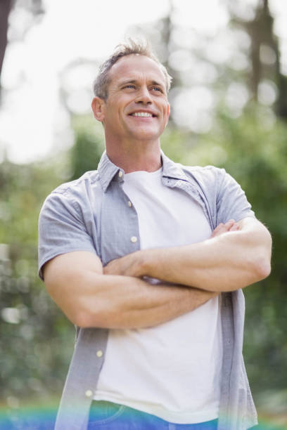 istock Smiling man crossing his arms 803138696