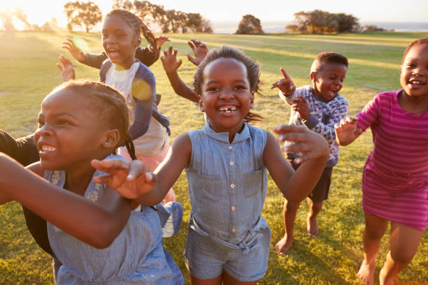 istock Elementary school kids running to camera outdoors, close up 803138710