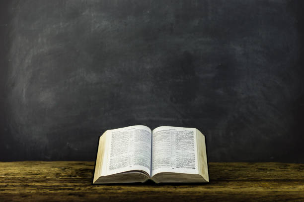 istock Bible on the old table. Beautiful background 803138784