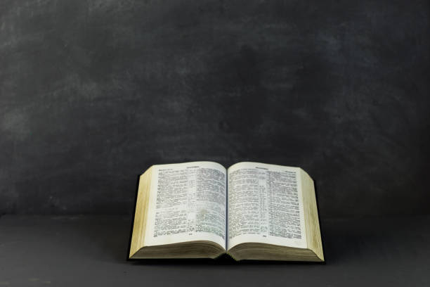 istock Bible on the old table. Beautiful background 803138842
