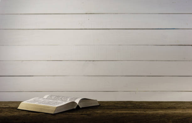 istock Bible on the old table. Beautiful background 803138956