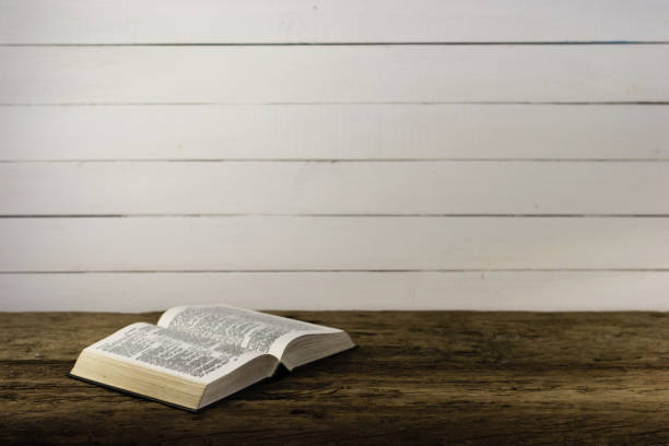 istock Bible on the old table. Beautiful background 803138992