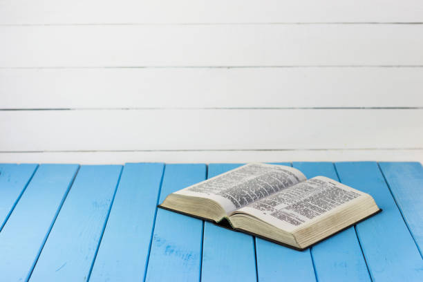 istock Bible on the old table. Beautiful background 803139940
