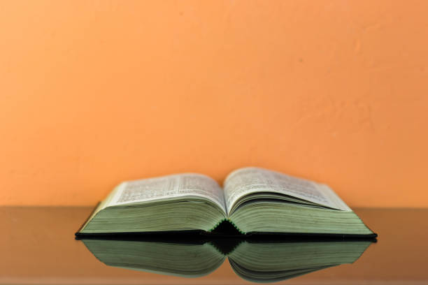 istock Bible on the old table. Beautiful background 803143298