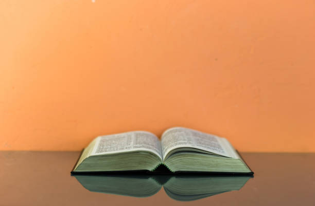 istock Bible on the old table. Beautiful background 803146394