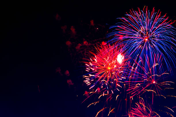 istock Beautiful colorful fireworks on sky. Fireworks display on dark sky background. Independence Day, 4th of July, Fourth of July or New Year 803153530