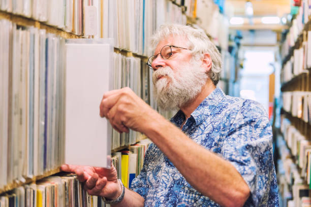 istock Senior man record store fan 803155224