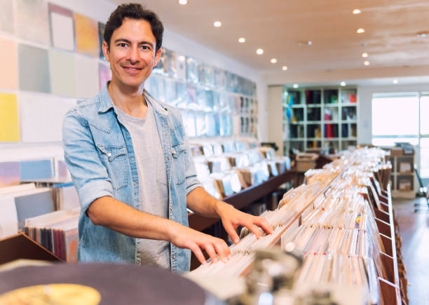 istock Audiophile man at the record store 803155242