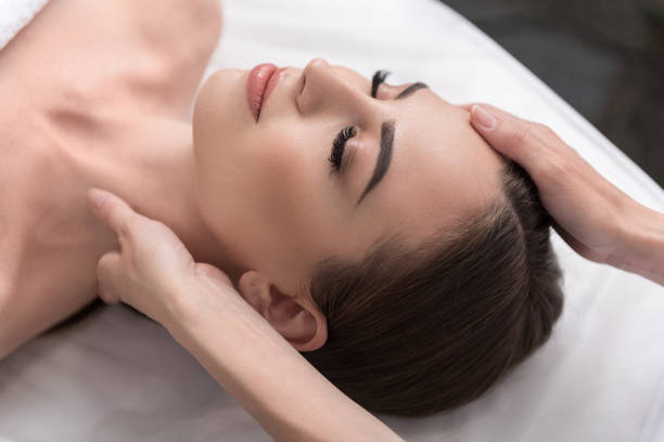 istock Pleasant girl is enjoying cosmetics procedures 803156038