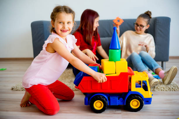 istock Girls with toy car 803170930
