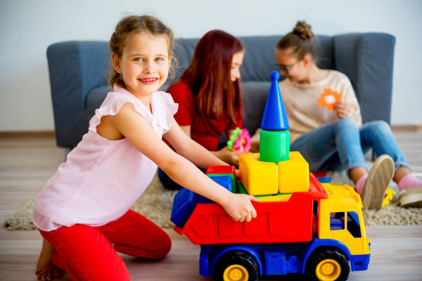 istock Girls with toy car 803170968
