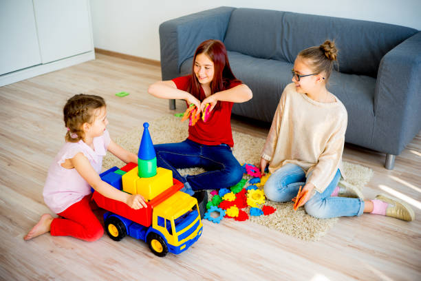 Girls with toy car