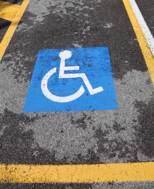 istock wheelchair symbol on a car reserved parking 803171270