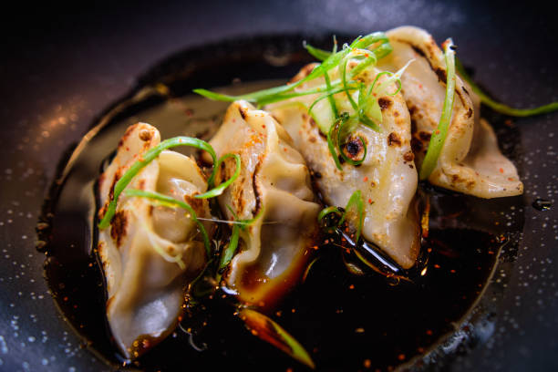 gyoza dumplings 2 gyoza dumplings chinese dumpling photos stock pictures, royalty-free photos & images