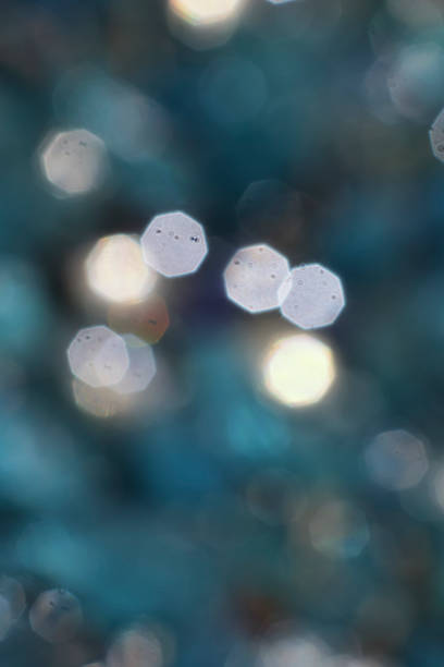istock Abstract soft lens bokeh background cyan white 803185772