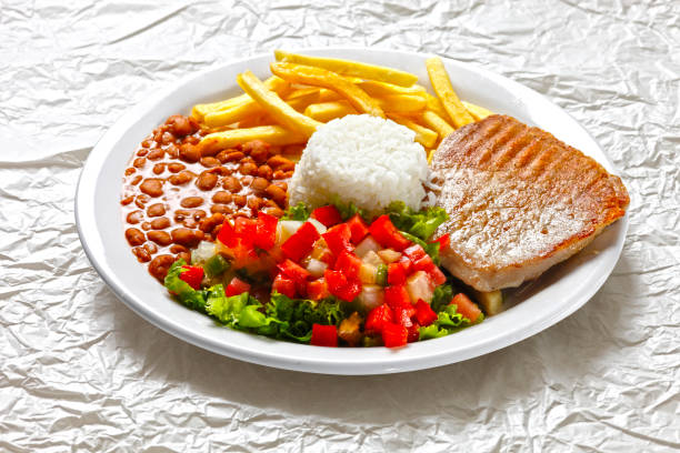 istock pork with rice and potatoes 803186130