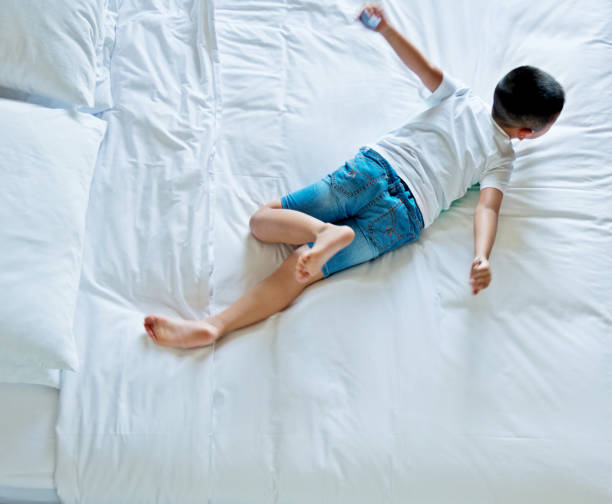istock Top view of little boy sleeping 803188520