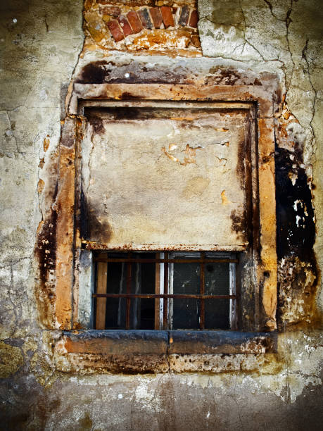 istock Grunge background - Old obsolete window in a medieval town 803193646