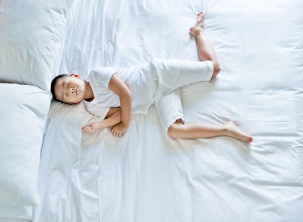 istock Top view of little boy sleeping 803200264