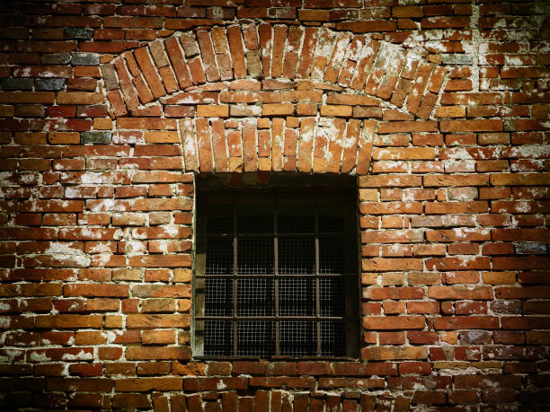 istock Grunge background - Old obsolete wall and window with iron grid 803200738