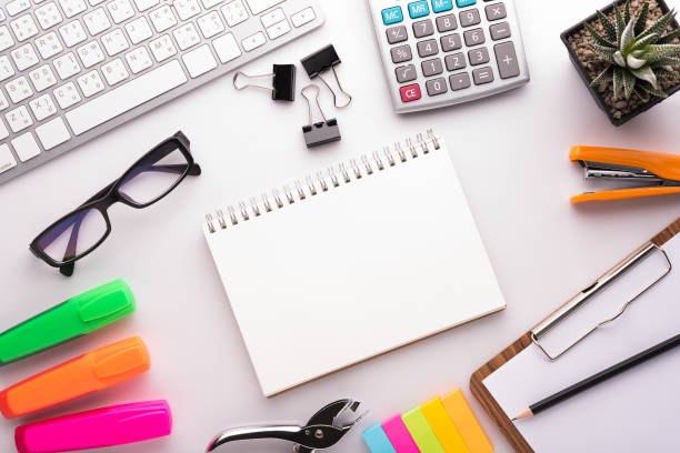 istock White office desk table with school accessories with office supplies. Top view with copy space 803211738