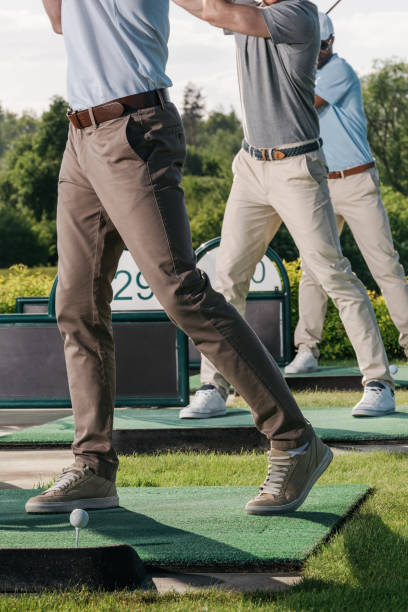 partial view of group of men playing golf together at golf course - golf course golf people sitting imagens e fotografias de stock