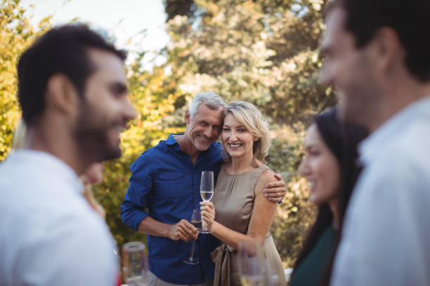 istock Affectionate couple having champagne in balcony 803220460