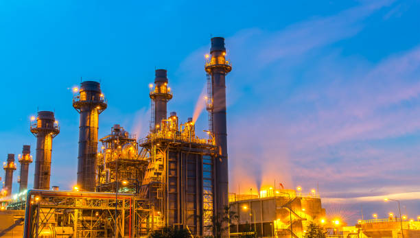 istock Oil refinery plant at twilight with sky background 803220778