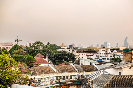 Bangkok cityscape with sky and horizontal line background from the rooftop bar at banglampoo Bangkok, Thailand