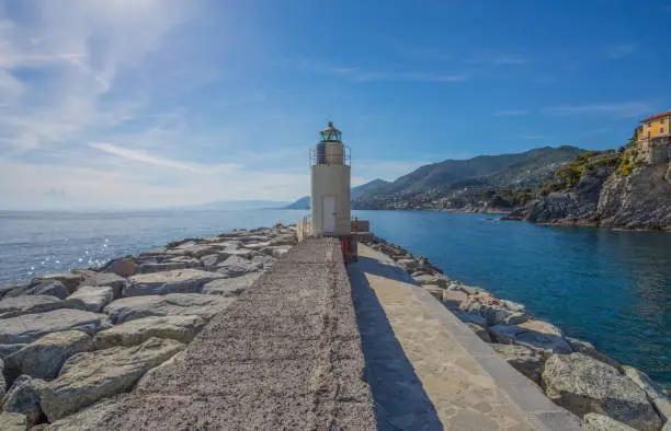 View of the lighthouse of city of Camogli, Genoa Province, Liguria, Mediterranean coast, Italy