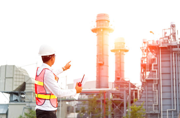 istock Engineer man hold radio work safety control at power plant energy industry.  Engineer Concept. 803240886