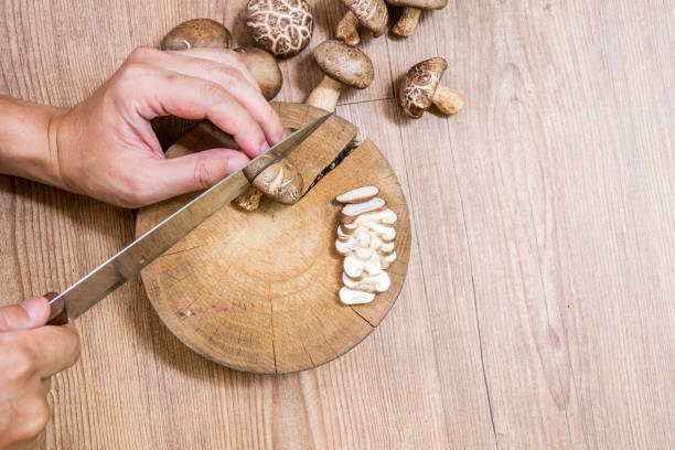 istock Fresh Shiitake mushroom Sliced on Chopping Board 803250392