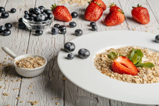 istock fresh Blueberries , strawberries and oatmeal 803257488