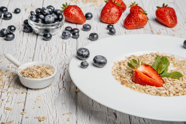 istock fresh Blueberries , strawberries and oatmeal 803257526