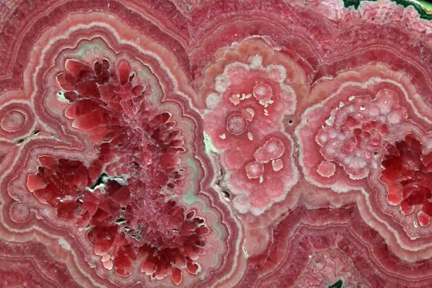 Rhodochrosite pink rose red stone is a manganese carbonate mineral with chemical composition MnCO3